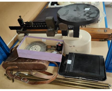 A scientific balance scale; a 1930's Kodak camera; etc. 