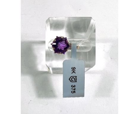 A Wobito Snowflake cut Moroccan Amethyst and diamond in 9ct hallmarked gold surround, Amethyst 4.12 carats and 9 small diamon