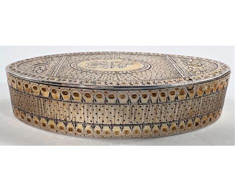 A late Georgian oval silver gilt snuff box with engraved decoration, makers mark PC (not identified) and assay only, c.1790, 