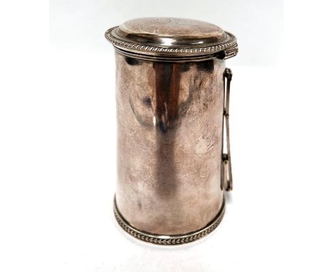 A George III early 19th century silver lidded hunting tankard with hinged strapwork folding handle, plain tapering form with 