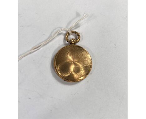 An unusual pendant locket/vinaigrette with ornate engine turning, internal hinged grill 