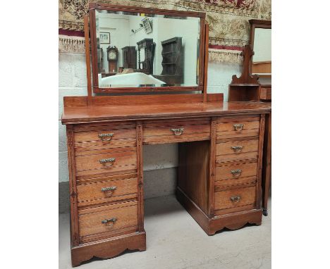 A late Victorian/Edwardian dressing chest of 9 drawers with swan neck handles and mirror 