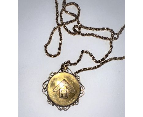 A Victorian 15 carat hallmarked gold pendant/ locket set with a ruby within a star, having scroll filigree border and Masonic