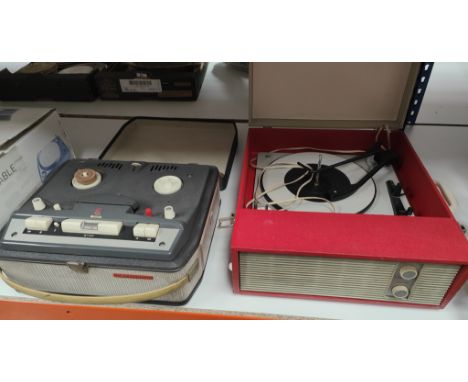 A vintage record travel record player and a Philips reel to reel tape recorder 