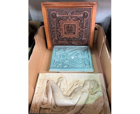 An Art Nouveau style tile/plaque depicting an angel; 2 carved wooden plaques 
