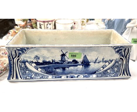 A Delftware rectangular flower trough decorated with Dutch scenes, length 40cm (glaze crazing) 