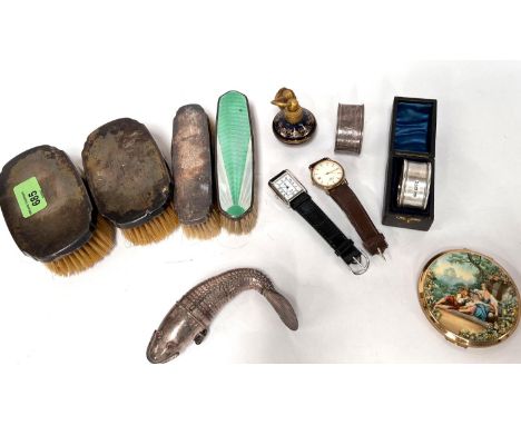 Two hallmarked silver napkin rings; a reticulated silver fish; a compact; silver back brushes; etc. 