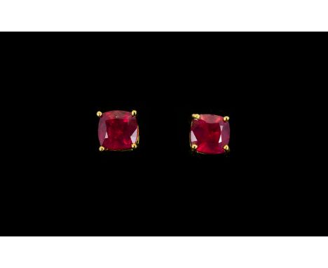 Ruby Pair of Square Cushion Cut Stud Earrings, the solitaire rubies of excellent colour, in a classic square cushion cut, tot