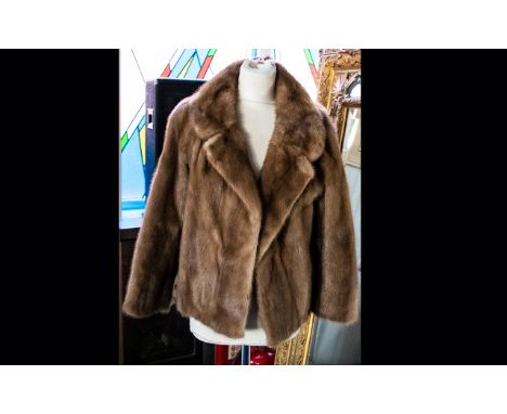 A Short Mink Evening Jacket Light golden brown hip length jacket with side seam pockets, revere collar and floral jacquard po