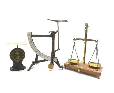 Set of brass balance scales and five weights on wooden base, set of quadrant scales with enamel register and a Salter letter 