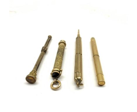 19th/ early 20th century propelling pencils to include an engraved example with amber glass matrix, two with engine turned de