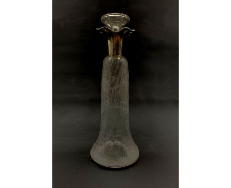 Edwardian silver mounted decanter in the manner of Stevens &amp; Williams, the swept tapered body cut in rock crystal style w