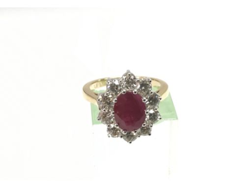 A certificated 18ct white and yellow gold oval cut ruby and diamond cluster ring. Ruby approx 1.50ct, diamonds approx 1.50ct,