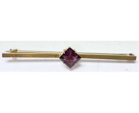 A 9ct gold brooch set with a singular amethyst.