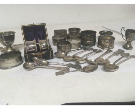 A collection of silver napkin rings Chinese silver spoons and other oddments (a lot)