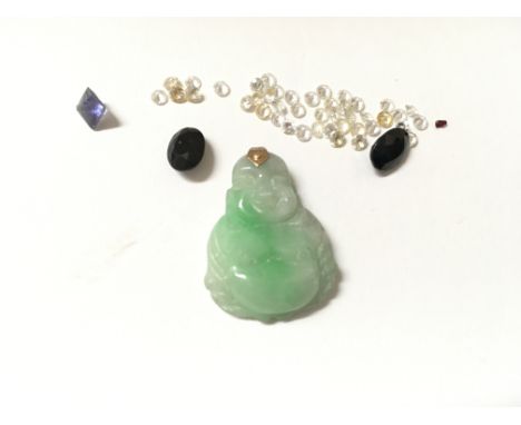 A jade pendant with a collection of loose stones. No reserve.