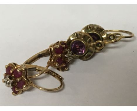 Two pairs of 9carat gold earrings set with amethyst and small ruby and chip diamonds. Weight 3g