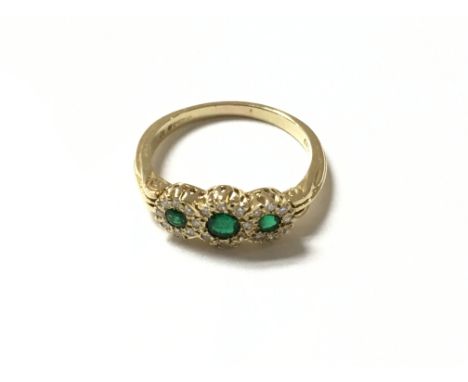 18ct gold diamond and emerald ring. Size R and 4.1g total weight appox.