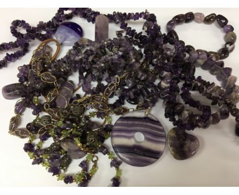 A collection of amethyst jewellery including necklaces, pendants and bracelets