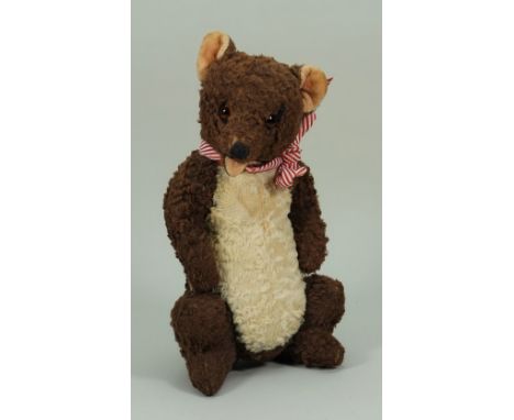 A rare Farnell seated open mouth Teddy bear, 1930s, the straw filled cotton plush brown and white bear with pink velvet plush