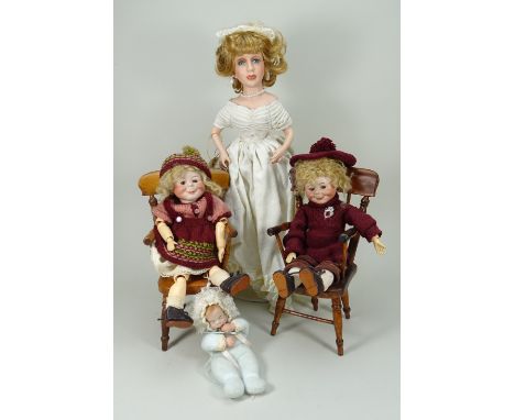 Pair of reproduction K&amp;R ‘Max’ character bisque head dolls, both with well modelled heads, glass brown eyes and water mel