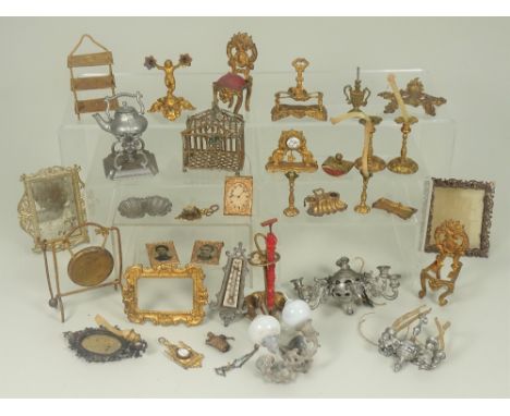 Gilt metal dolls house miniatures, 1880s, including pair of ornate candle sticks, mantle clock, gong, hanging shelf, ink blot