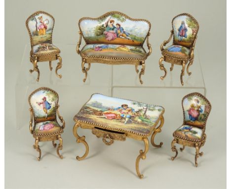 Austrian enamel hand painted miniature gilt furniture, early 20th century, including settee, four chairs and oblong table wit