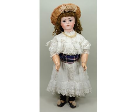 A good size 12 Bru Jne R bisque head bebe doll, French circa 1895, the lovely pale oily bisque head with fixed brown glass pa