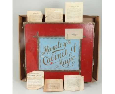 Hamley’s Cabinet of Magic, circa 1900, wooden box with inner compartments containing a selection of metal, wood and paper pro