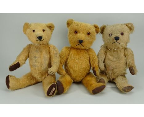 Three English mohair Teddy Bears, 1950s, including two Chiltern bears with orange glass eyes, stitched shield shaped noses an