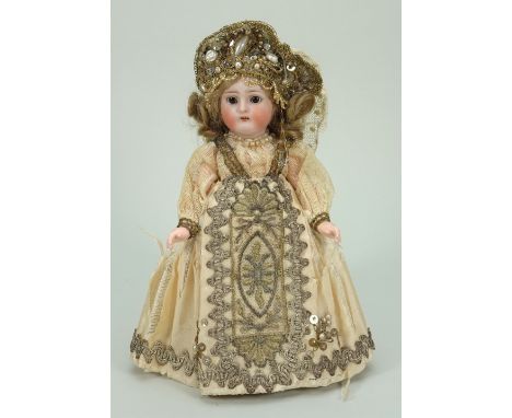 A charming Simon &amp; Halbig/K&amp;R Holy Communion bisque head doll, German circa 1905, with weighted brown glass eyes, pai