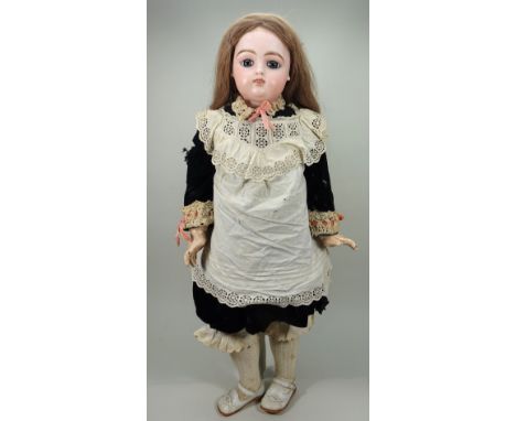 A large Francois Gaultier bisque head Bebe doll, French circa 1895, with large fixed blue glass paperweight eyes, finely pain