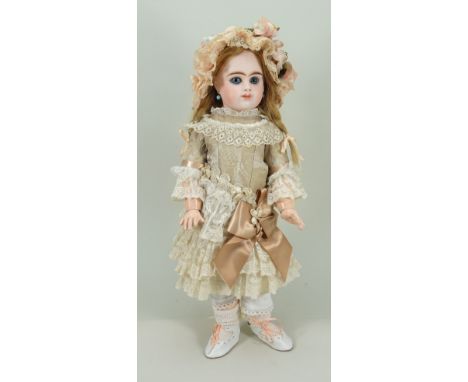 Etienne Denamur bisque head Bebe doll, French circa 1890, the pale bisque head with fixed light blue glass paper-weight eyes,