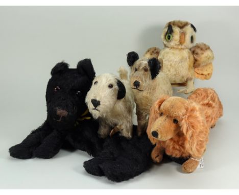 Four soft toy dogs, 1930s/50s, Steiff Dachshund with button, 16” (41cm) long, Chad Valley Terrier, black Scottie pyjama case,