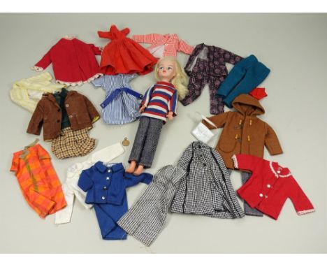 Vintage Hong Kong Sindy doll and a collection of clothes, Sindy with right side parting wearing blue, red and white striped t