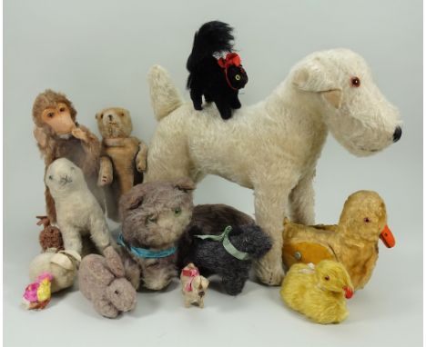 Collection of various soft toys, English 1930-50, including a brown mohair glove puppet with orange glass eyes and stitched b