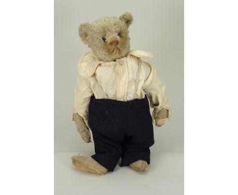 White mohair Steiff Teddy bear, German circa 1909, the straw filled bear with black boot button eyes, pointed snout and light