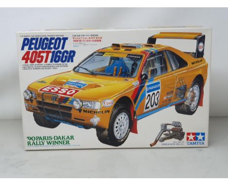 A Tamiya 1/24 scale Peuget 405T 160GR Kit, appears unopened with original tape 