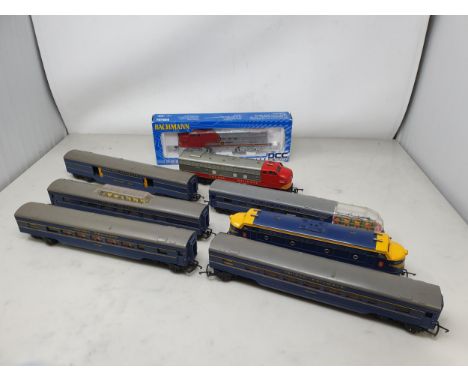 A boxed Bachmann HO scale No.60102 Santa Fe Diesel Locomotive, two Triang American diesel Locomotives and five Coaches 