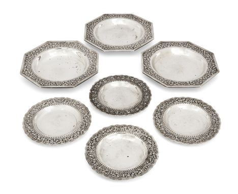 Three mid-20th century Cambodian dishes. Stamped T950. Of hexagonal form, the borders chased with flowers and scrolls to shal