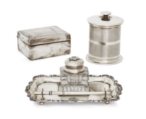 A small group of silver including an inkstand. Various dates and makers. The inkstand designed with a scroll border and suppo