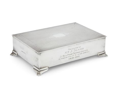 An Art Deco-style silver cigarette box. Harman Brothers, Birmingham, 1948. Of rectangular form and raised on four bracket fee