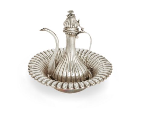 An Ottoman silver ewer and basin. Late 19th/early 20th century, 900 standard. The melon fluted baluster-shaped ewer designed 