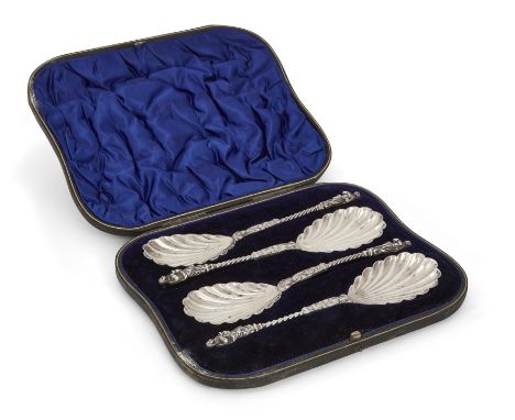 A boxed set of Edwardian silver fruit spoons. William Hutton & Sons, London, 1901. The oval shell-design bowls to half twiste