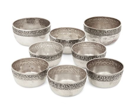 A group of eight Cambodian bowls. Stamped 900, Mid-20th century. All decorated with an embossed and chased band beneath rims,