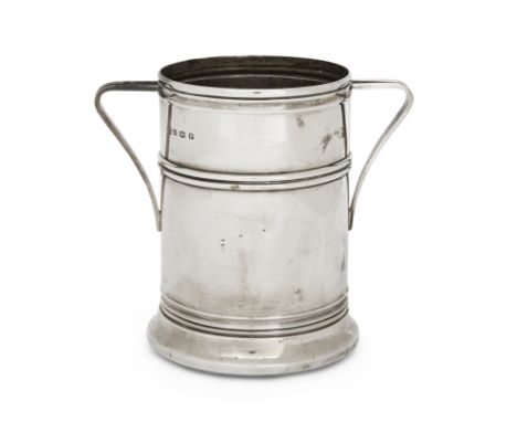 A George V silver bottle coaster. William Hutton & Sons, Sheffield, 1928. Of tall, cylindrical form, the straight sides to a 