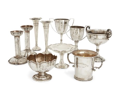 A George V silver trophy cup. Elkington & Co., Birmingham, 1912. The knopped stem to a stepped circular foot, with angular ha