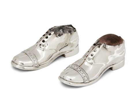 Two novelty silver shoe pin cushions. Birmingham, 1921 and 1922, S. Blanckensee & Son. Designed with pierced eyelets and an a