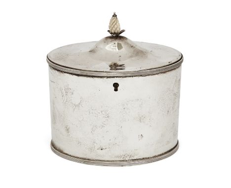 A George III silver tea caddy. Henry Chawner, London, 1788. Of oval form with reeding to foot and upper rim, the hinged, dome