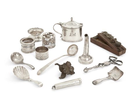 A group of silver oddments. Various dates and makers. The group including: a William IV caddy spoon, Birmingham, 1834, George